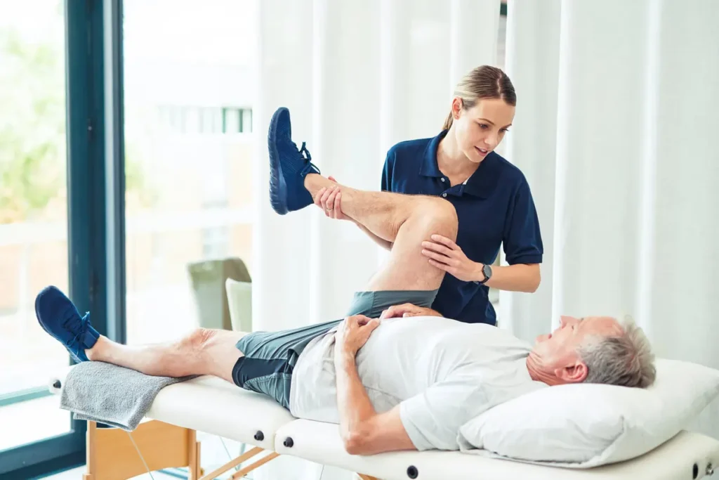 Revitalising Recovery: Effective Rehabilitation Strategies for Muscle Injuries 3 Physiotherapist assisting a patient with muscle recovery exercises Rowley Regis