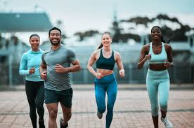 Sculpting Sleek Arms: The Essential Role of Cardio in Toning Without Bulking Up 3 image of people running to incorporate cardio Rowley Regis exercise into their life to help tone arms and body.
